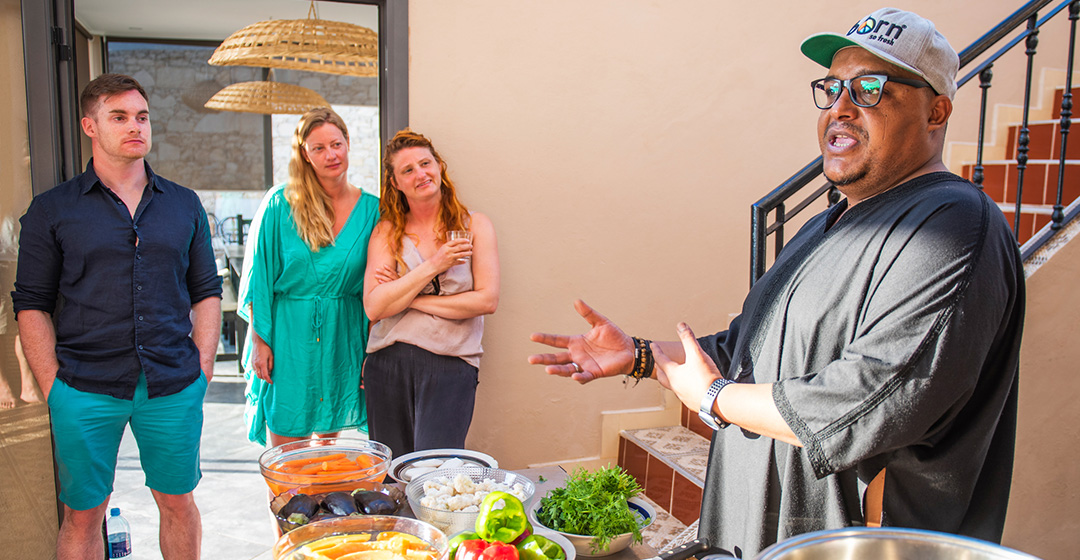 Momo teaches guests how to cook authentic Moroccan cuisine.